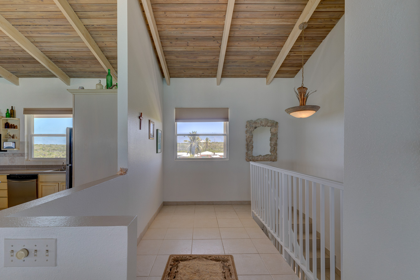 The stairs down to the ground floor at The Family Beach House on San Salvador