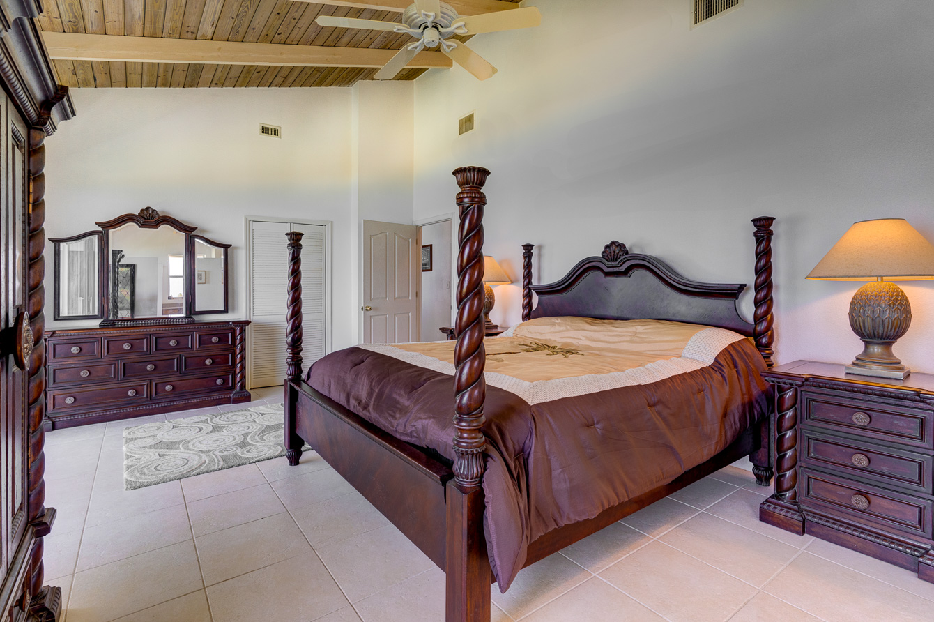The master bedroom at the The Family Beach House on San Salvador