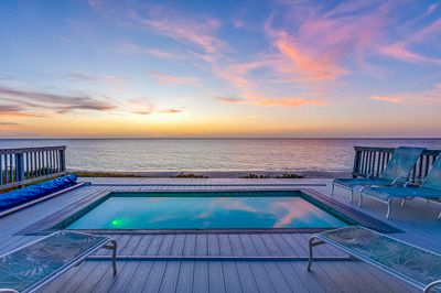 The pool at sunset at The Family Beach House on San Salvador 