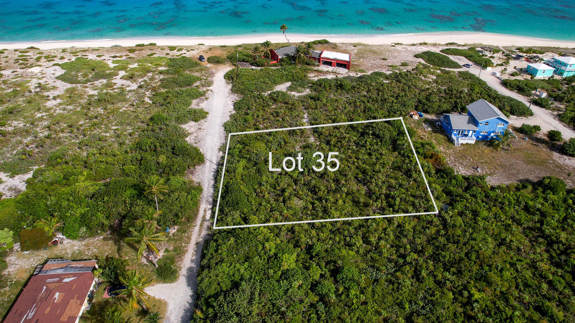 Vacant half acre lot 2 lots from stunning beach in Sandy Point, San Salvador, The Bahamas