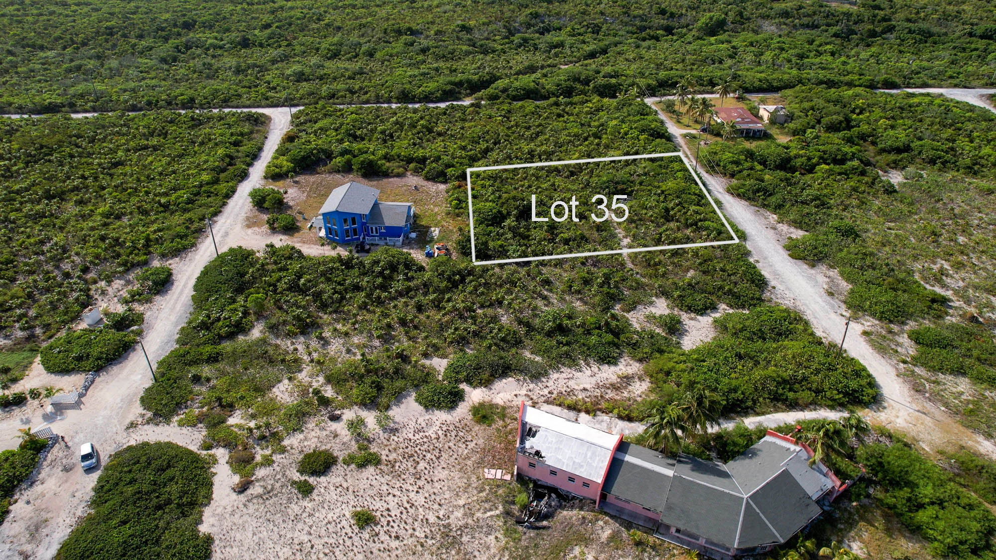 Vacant half acre lot 2 lots from stunning beach in Sandy Point, San Salvador, The Bahamas