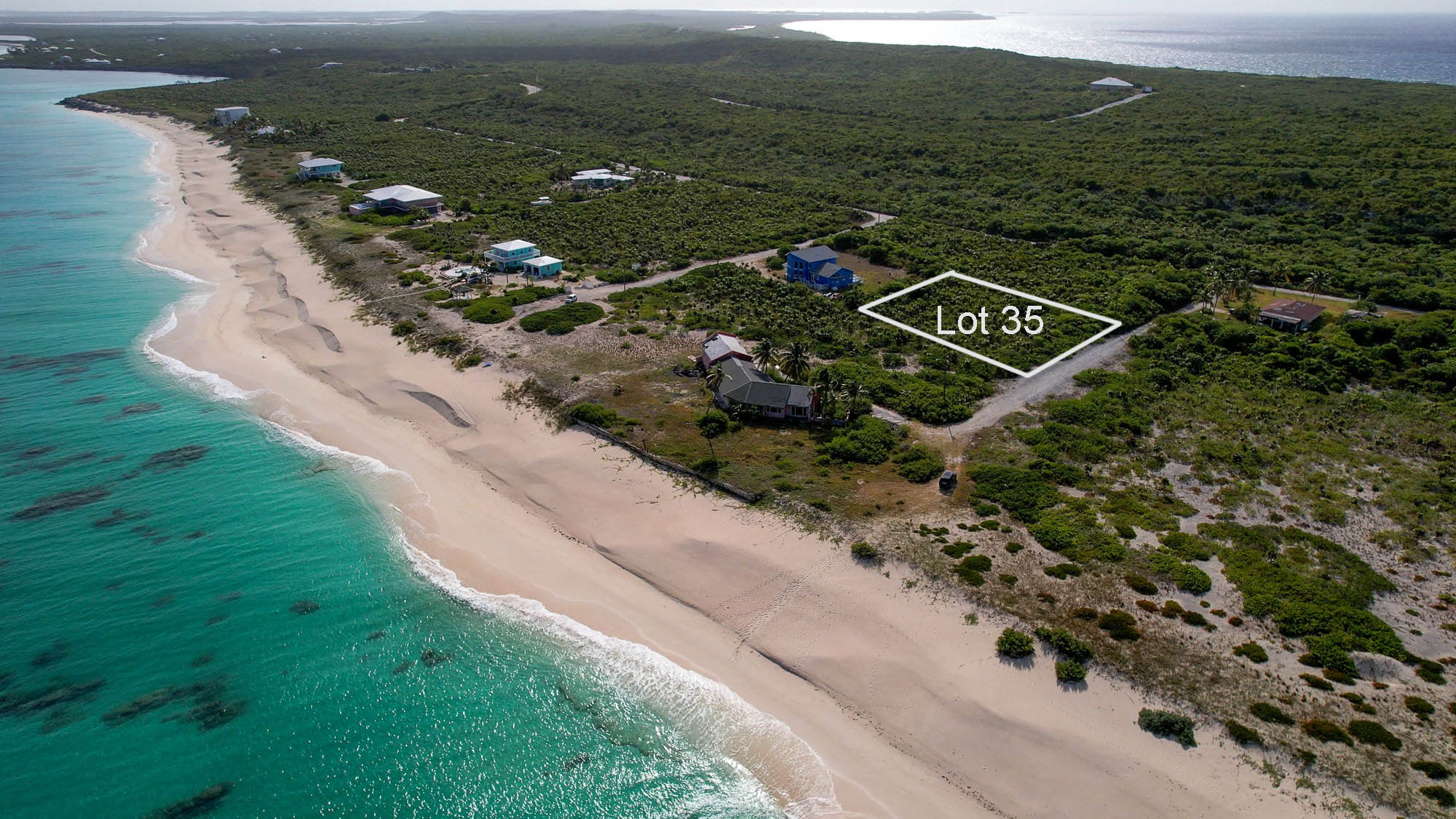 Vacant half acre lot 2 lots from stunning beach in Sandy Point, San Salvador, The Bahamas