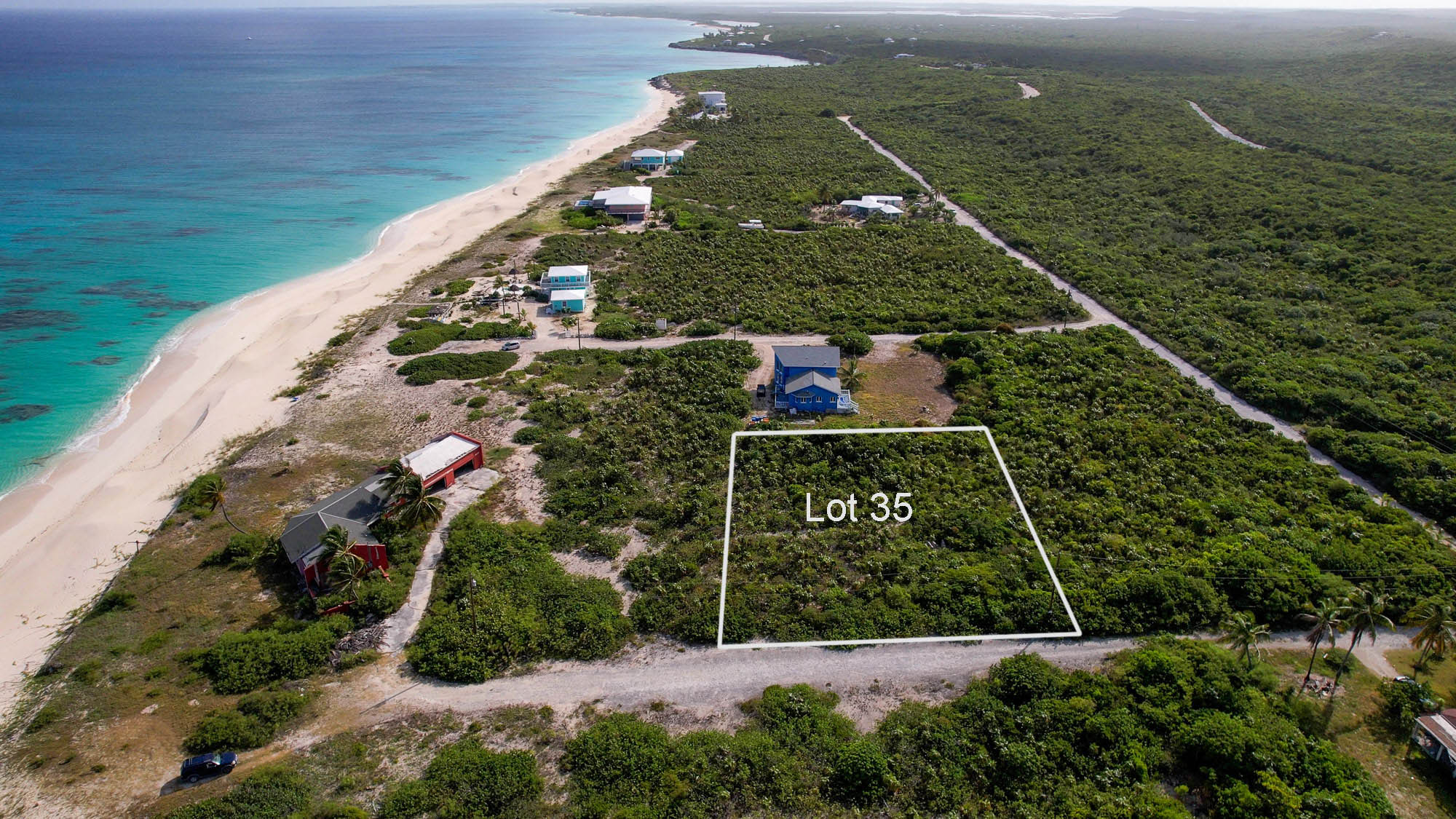 Vacant half acre lot 2 lots from stunning beach in Sandy Point, San Salvador, The Bahamas