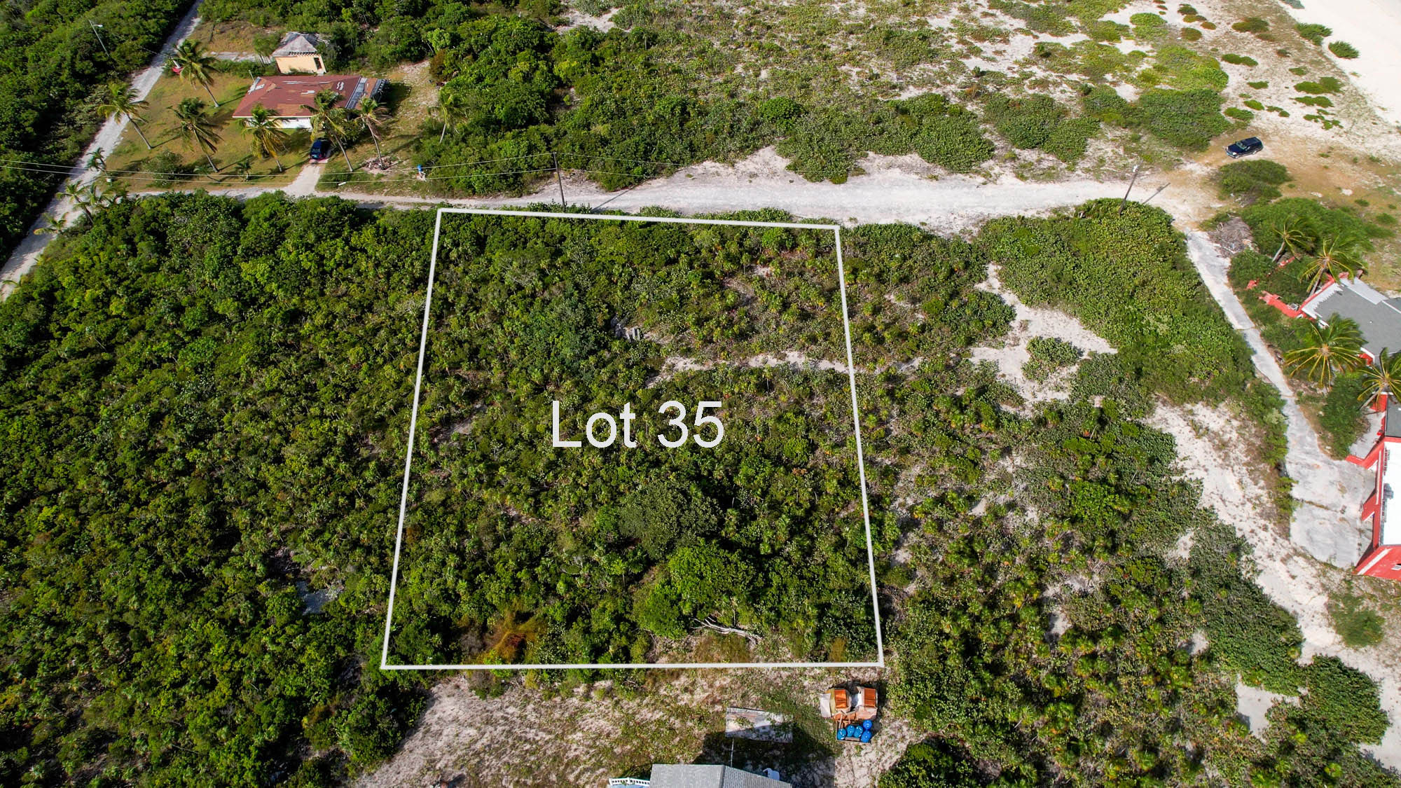 Vacant half acre lot 2 lots from stunning beach in Sandy Point, San Salvador, The Bahamas